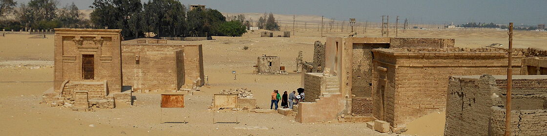 Overview of the central monument area with ancient tombs, chapels, and temple structures preserved within the necropolis of Tuna el-Gebel.