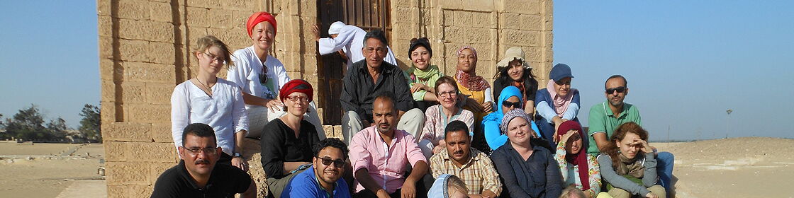 Archaeologists, specialists, and local workers documenting and excavating the archaeological remains of Tuna el-Gebel.